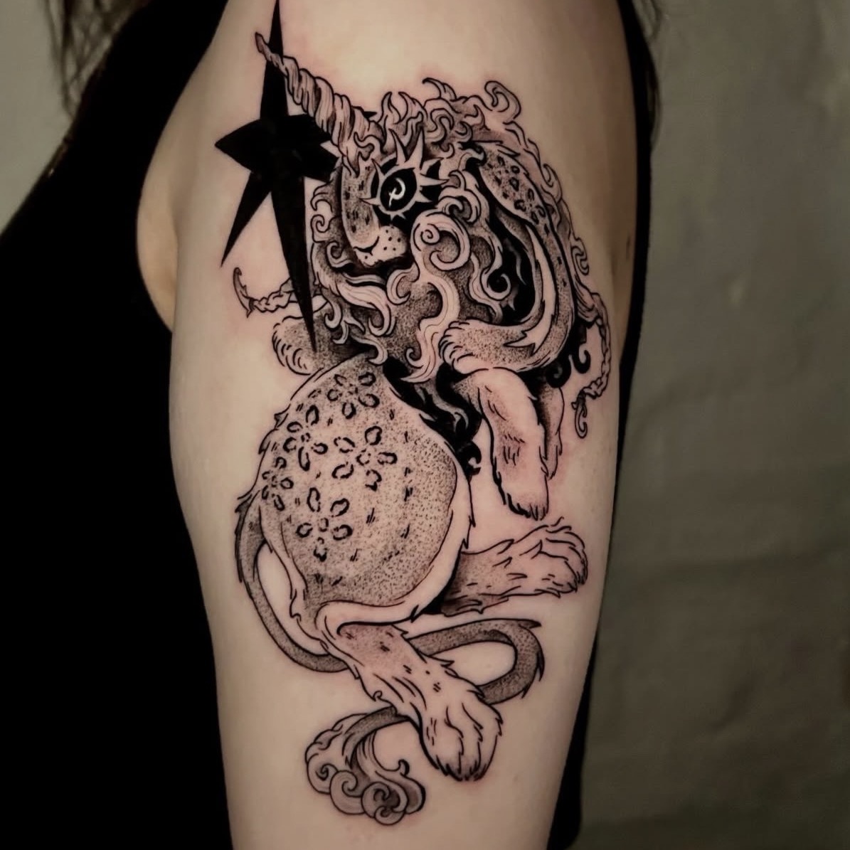 Animal blackwork tattoo by Imogen