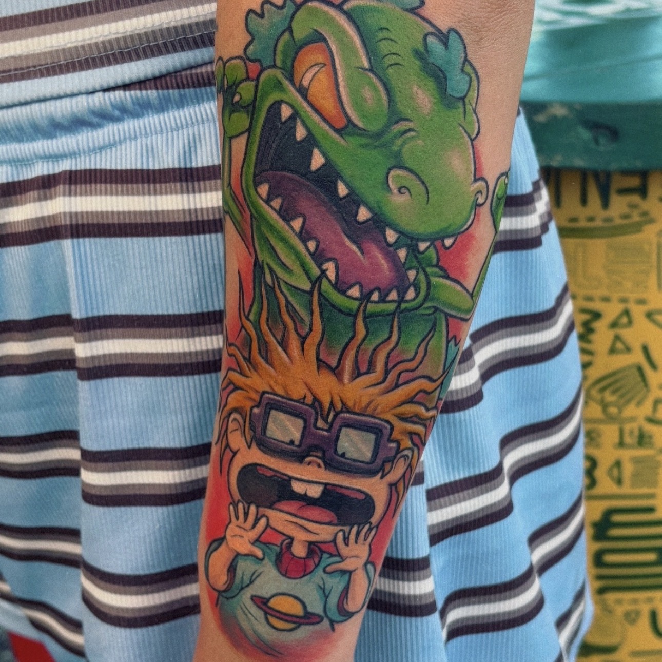 Cartoon sleeve tattoo by Robb